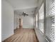 Bright living room with hardwood floors and large windows, creating an inviting and airy atmosphere at 204 Rose Water Loop # 204, Myrtle Beach, SC 29588