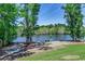 Community picnic area by the river with mature trees and well-maintained landscaping with multiple picnic tables at 204 Rose Water Loop # 204, Myrtle Beach, SC 29588
