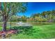 Scenic pond view featuring a fountain and lush green surroundings, perfect for relaxation and enjoying nature's beauty at 204 Rose Water Loop # 204, Myrtle Beach, SC 29588