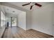 Sun-filled sun room with laminate flooring, a ceiling fan, and sliding glass door access at 204 Rose Water Loop # 204, Myrtle Beach, SC 29588