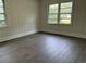 Comfortable bedroom with vinyl floors and natural light at 205 S Oliver Blvd., Hemingway, SC 29554