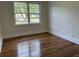 Serene bedroom offering hardwood floors and a view of the outdoors at 205 S Oliver Blvd., Hemingway, SC 29554