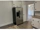 Well-equipped kitchen featuring ample storage and stainless-steel refrigerator at 205 S Oliver Blvd., Hemingway, SC 29554