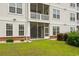 Backyard view of the home featuring a small lawn, patio, and a screened-in porch above at 2241 Waterview Dr. # 514, North Myrtle Beach, SC 29582