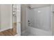 Bright bathroom with a bathtub and shower, and a doorway to another room at 2241 Waterview Dr. # 514, North Myrtle Beach, SC 29582