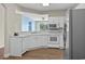 Kitchen features stainless steel appliances, wood floors, and views into the living area at 2241 Waterview Dr. # 514, North Myrtle Beach, SC 29582