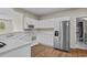 Well-lit kitchen with white cabinets and modern stainless-steel refrigerator at 2241 Waterview Dr. # 514, North Myrtle Beach, SC 29582