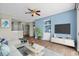 Cozy living room with built-in shelving and a TV, furnished with a sofa and coffee table at 2241 Waterview Dr. # 514, North Myrtle Beach, SC 29582