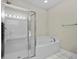 Well-lit main bathroom features a shower/tub with glass doors and chrome towel racks at 2241 Waterview Dr. # 514, North Myrtle Beach, SC 29582
