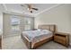 Bedroom featuring a king bed, carpet, side tables, and natural light from two windows at 2241 Waterview Dr. # 514, North Myrtle Beach, SC 29582