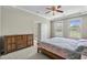 Bright main bedroom with a ceiling fan, dresser, and an entry to another room at 2241 Waterview Dr. # 514, North Myrtle Beach, SC 29582