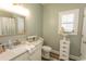 Coastal themed bathroom with marble countertops, a framed mirror, and beach-inspired decor at 2428 Little River Neck Rd. # 101, North Myrtle Beach, SC 29582