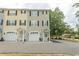 View of townhomes with front-entry garages and manicured landscaping for curb appeal at 2428 Little River Neck Rd. # 101, North Myrtle Beach, SC 29582