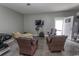 Finished garage with seating area, TV, fan, and access to the backyard at 2428 Little River Neck Rd. # 101, North Myrtle Beach, SC 29582