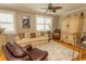 Comfortable living room featuring plantation shutters, hardwood floors, and neutral-toned decor at 2428 Little River Neck Rd. # 101, North Myrtle Beach, SC 29582