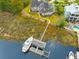 An aerial shot of an estate home with expansive grounds, dock, and water access at 2715 Ships Wheel Dr., North Myrtle Beach, SC 29582