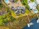 Aerial view showcasing an expansive estate with a boat dock on the water at 2715 Ships Wheel Dr., North Myrtle Beach, SC 29582
