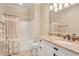 Bright bathroom with a shower-tub combo, granite countertop, and patterned shower curtain at 2715 Ships Wheel Dr., North Myrtle Beach, SC 29582