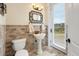 Powder room featuring unique tile work, a pedestal sink, and a view of the water at 2715 Ships Wheel Dr., North Myrtle Beach, SC 29582