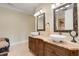 Bathroom featuring a double vanity with vessel sinks and decorative mirrors at 2715 Ships Wheel Dr., North Myrtle Beach, SC 29582