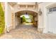 Charming courtyard with brick pavers, lantern lighting, and waterfront views beyond at 2715 Ships Wheel Dr., North Myrtle Beach, SC 29582