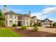 Beautiful estate with lush landscaping, a circular driveway, and a classic fountain at 2715 Ships Wheel Dr., North Myrtle Beach, SC 29582