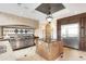 Gourmet kitchen with custom island, stainless steel appliances, and designer lighting at 2715 Ships Wheel Dr., North Myrtle Beach, SC 29582