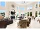 Expansive living room with soaring ceilings, fireplace, and abundant natural light at 2715 Ships Wheel Dr., North Myrtle Beach, SC 29582
