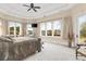Bright bedroom with waterfront views, sitting area, plush carpeting, and elegant furnishings at 2715 Ships Wheel Dr., North Myrtle Beach, SC 29582