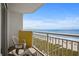 Enjoy ocean views from this condo balcony with patio furniture and white railing at 2801 S Ocean Blvd. # 835, North Myrtle Beach, SC 29582
