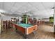 Spacious game room with a pool table, seating, and tables at 2801 S Ocean Blvd. # 835, North Myrtle Beach, SC 29582