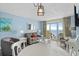 Relax in this living room with access to the balcony and expansive ocean views at 2801 S Ocean Blvd. # 835, North Myrtle Beach, SC 29582