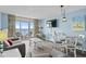 Comfortable living and dining room with access to the balcony and ocean view at 2801 S Ocean Blvd. # 835, North Myrtle Beach, SC 29582