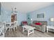 Open-concept living and dining area, with a mirror and ocean view balcony at 2801 S Ocean Blvd. # 835, North Myrtle Beach, SC 29582