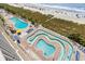 Aerial view of resort's amenity with multiple swimming pools and a lazy river, close to the beach at 2801 S Ocean Blvd. # 835, North Myrtle Beach, SC 29582