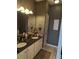 Bathroom vanity showcasing double sinks with granite countertops and ample lighting at 2834 Howard Ave. # D, Myrtle Beach, SC 29577