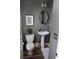 Small and stylish powder room featuring modern fixtures, a pedestal sink, and gray paint at 2834 Howard Ave. # D, Myrtle Beach, SC 29577
