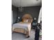 Comfortable bedroom featuring a gold sunburst headboard, chandelier, and calming gray walls at 2834 Howard Ave. # D, Myrtle Beach, SC 29577