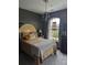 Bedroom showcasing natural light, a statement headboard, and a decorative chandelier at 2834 Howard Ave. # D, Myrtle Beach, SC 29577