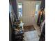 Bright entryway featuring a white door with sidelights and well-organized decor at 2834 Howard Ave. # D, Myrtle Beach, SC 29577