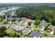 An aerial view of a quiet neighborhood close to a wooded area at 29 Saltwind Loop, Murrells Inlet, SC 29576