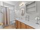 Well-lit bathroom with a shower-tub combo, white vanity, neutral walls, and ample counter space at 29 Saltwind Loop, Murrells Inlet, SC 29576