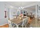 Dining room featuring a wooden table, seating for six, and an open layout to the living areas at 29 Saltwind Loop, Murrells Inlet, SC 29576