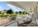 Relaxing front porch features rocking chairs, hanging ferns, and a view of the landscaped yard at 29 Saltwind Loop, Murrells Inlet, SC 29576
