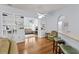 Open-concept living area with hardwood floors, built-in shelving, and arched doorways at 29 Saltwind Loop, Murrells Inlet, SC 29576