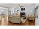 Comfortable living room with hardwood floors, a fireplace, and an open view into the dining area at 29 Saltwind Loop, Murrells Inlet, SC 29576