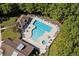Aerial view of a large outdoor pool with plenty of seating and manicured landscaping at 29 Saltwind Loop, Murrells Inlet, SC 29576