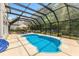 A screened-in pool area features a heated pool and outdoor dining at 29 Saltwind Loop, Murrells Inlet, SC 29576