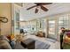 Cozy sunroom with plenty of natural light, seating area, fan, and access to outdoor space at 29 Saltwind Loop, Murrells Inlet, SC 29576