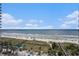 Breathtaking aerial view of the beach with beachgoers from a high-rise condo at 300 N Ocean Blvd. # 723, North Myrtle Beach, SC 29582